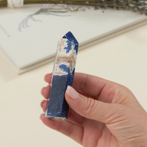 sodalite crystal tower for sale held in a woman's hand